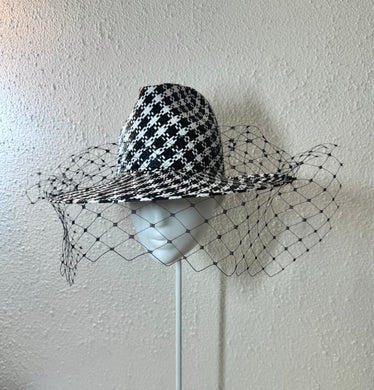 Black and white houndstooth fedora with black wide veil