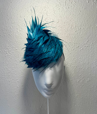 Featherwork in dark teal