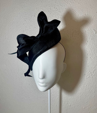 Blackest beret and sculptured bow