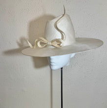 The ivory flat brimmed fedora