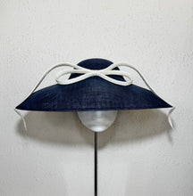 Coolie in navy with upside down bow