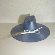 Flat brim fedora and dimple
