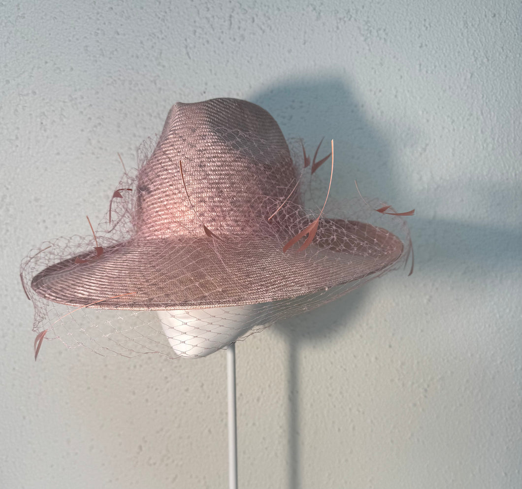 Pale pink feathered fedora